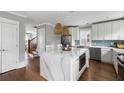 Bright kitchen with white cabinets, stainless steel appliances, and a center island with marble countertop at 972 Key Colony Ct, Mount Pleasant, SC 29464