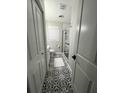 Bathroom showcasing a glass shower, a black and white patterned floor, and a modern vanity at 116 Lyle Rd, Goose Creek, SC 29445