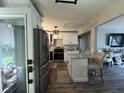Stylish kitchen featuring stainless appliances, white cabinets, and an island with chairs at 116 Lyle Rd, Goose Creek, SC 29445