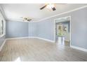 Bright and airy living room with wood-look floors and a large window at 141 Cannon Ave, Goose Creek, SC 29445