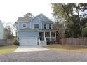 Charming two-story home with a welcoming front porch and a well-manicured lawn at 1601 Secessionville Rd, Charleston, SC 29412