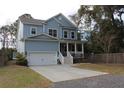 Charming two-story home with a welcoming front porch and a well-manicured lawn at 1601 Secessionville Rd, Charleston, SC 29412