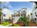 Beautiful two-story home with inviting front porch, lush landscaping, and charming curb appeal at 1738 Cultivation Ln # 532, Mount Pleasant, SC 29466