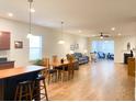 Bright, open-concept living area with hardwood floors, plenty of natural light, and a smooth transition to the living room at 2117 Colson Ln, Johns Island, SC 29455