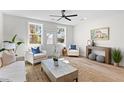 Bright living room featuring hardwood floors, white walls, and modern furniture, creating a cozy and inviting space at 2193 Helm Ave, North Charleston, SC 29405