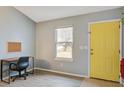 Study area with a desk and a window allowing natural light and a yellow door at 311 Macgregor Dr, Summerville, SC 29486