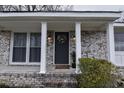 Inviting covered porch with white columns and brick accents, perfect for relaxing outdoors at 338 Holly Ave, Goose Creek, SC 29445