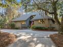 A single-Gathering home featuring an inviting, landscaped front yard and private driveway at 385 Green Winged Teal Rd, Kiawah Island, SC 29455