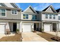 Well-kept townhomes showing individual styles, garages, and tidy front yards at 447 Duskywing Dr, Goose Creek, SC 29445