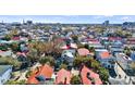 Charming Charleston single house with a light roof, nestled among trees in a historic neighborhood with city skyline views at 45 Bogard St, Charleston, SC 29403