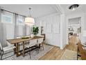 Elegant dining room featuring a wood table, stylish chairs, and lots of natural light at 709 Alma Square Dr, Moncks Corner, SC 29461