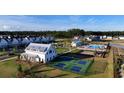 New construction neighborhood featuring a community pool, playground, and pickleball courts at 1058 Marsh Harrier Dr # 15-7P, Ravenel, SC 29470