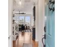 Inviting foyer featuring hardwood floors, staircase, and views into the living area at 1122 St Pauls Parrish Ln, Johns Island, SC 29455