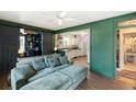 Inviting living room featuring stylish green walls, an open floor plan, and a comfortable sectional sofa at 1195 Marquis Rd, North Charleston, SC 29405