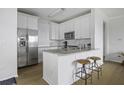 Modern kitchen with stainless steel appliances, granite countertops, and white cabinetry at 130 River Landing Dr # 7309, Charleston, SC 29492