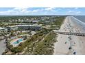 Aerial view of a beachfront condominium near a sandy beach and a community pool at 1300 Ocean Blvd # 102 A, Isle of Palms, SC 29451