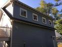 The back of the carriage house showing windows on the upper level and steps leading to a balcony at 1328 Erckmann Dr, Mount Pleasant, SC 29464