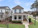 Inviting two-story home with a charming front porch, offering a relaxing outdoor space at 1556 Cranes Nest Rd, Mount Pleasant, SC 29466