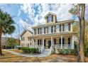 Charming two-story home with a welcoming front porch, complemented by a manicured lawn at 1769 Greenspoint Court, Mount Pleasant, SC 29466