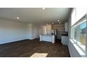 Open-concept living room flowing into a kitchen with stainless steel appliances and granite countertops at 210 Blue Haw Dr, Moncks Corner, SC 29461