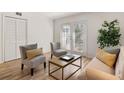 Living room with neutral tones, wood floors, and a coffee table at 2362 Parsonage Rd # 17G, Charleston, SC 29414