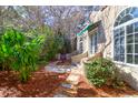 Inviting outdoor patio with stone walkway, lush greenery, and a charming covered area at 339 Cabell St, Charleston, SC 29407