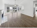 Inviting living space with fireplace, sleek floors, neutral paint, and large windows to the backyard at 5509 Copper Trce, North Charleston, SC 29418