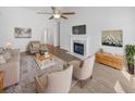 Bright and airy living room boasts a fireplace, vaulted ceiling with fan, and neutral decor at 5509 Copper Trce, North Charleston, SC 29418