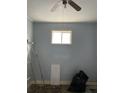 Empty bedroom with pale blue walls, featuring a window and space for customization at 90 Romney St, Charleston, SC 29403