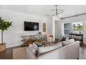 Bright living room featuring a large flatscreen TV, neutral decor, and beautiful views at 103 Pen Shell St, Summerville, SC 29485