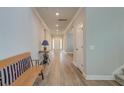 Bright and airy entryway boasting light wood floors, neutral walls, and recessed lighting at 146 Stagecoach Ave, Summerville, SC 29486