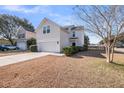 Charming home featuring a two-car garage and a well-maintained lawn at 1501 Mcintosh Road, Johns Island, SC 29455