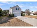 Charming home featuring a two-car garage and a well-maintained lawn at 1501 Mcintosh Road, Johns Island, SC 29455