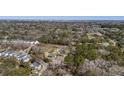 Wide aerial perspective featuring homes surrounded by verdant trees, offering a blend of nature and community living at 1812 Burgess St, Charleston, SC 29412