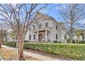 Elegant two-story home showcasing classic architecture and neat, green landscaping at 213 Amberjack Ln, Charleston, SC 29492
