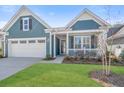 Beautiful single-Gathering home with a well-maintained lawn and a charming front porch at 222 River Martin Ct, Summerville, SC 29483