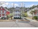 Charming two-story home with double porches, manicured landscaping, and a classic Lowcountry design at 2516 Willbrook Ln, Mount Pleasant, SC 29466