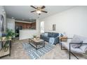 Well-lit living room features neutral tones, with a ceiling fan and an open floor plan at 3621 Locklear Ln, Mount Pleasant, SC 29466