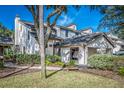 Charming condo exterior featuring a private entrance, lush landscaping and well-maintained grounds at 401 Yacht Harbor Ct, Isle of Palms, SC 29451