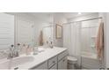 Clean bathroom features a single sink vanity, toilet, and shower with white curtain at 546 Richfield Way, Summerville, SC 29486