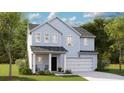 Charming two-story home featuring a covered entry, an attached two car garage, and professionally landscaped yard at 605 Red Monarch Way, Moncks Corner, SC 29461
