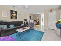 Inviting living room with a plush blue rug, comfortable seating, and stylish decor at 925 Dills Bluff Rd # 34, Charleston, SC 29412