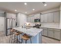 Modern kitchen with granite island, stainless steel appliances, and ample cabinet space at 109 Forest Springs Rd, Moncks Corner, SC 29461