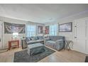 Comfortable living room with modern decor, plush sofas, and soft lighting, ideal for relaxation and entertainment at 111 Summit Ave, Goose Creek, SC 29445