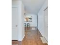 Inviting hallway with sleek hardwood floors leading to open living spaces and natural light at 152 Coosawatchie St, Summerville, SC 29485