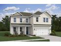 Charming two story home with a covered front porch, attached two car garage, and manicured lawn at 2026 Mcguire Ln # 007, Hollywood, SC 29449