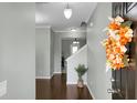 Inviting foyer with hardwood floors, stylish decor, and views of the staircase at 212 Medford Dr, Summerville, SC 29485