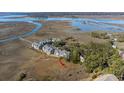 Scenic aerial view of the condo community nestled along the marsh with water views at 2135 Landfall Way, Seabrook Island, SC 29455