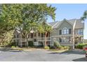 Charming condo with a private balcony, mature trees, and convenient parking spaces at 2135 Landfall Way, Seabrook Island, SC 29455