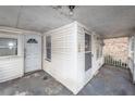 Covered front porch with white railings and view of the house's entrance at 355 Nassau St, Charleston, SC 29403